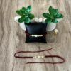 Pearl Spiral Maroon Rakhi